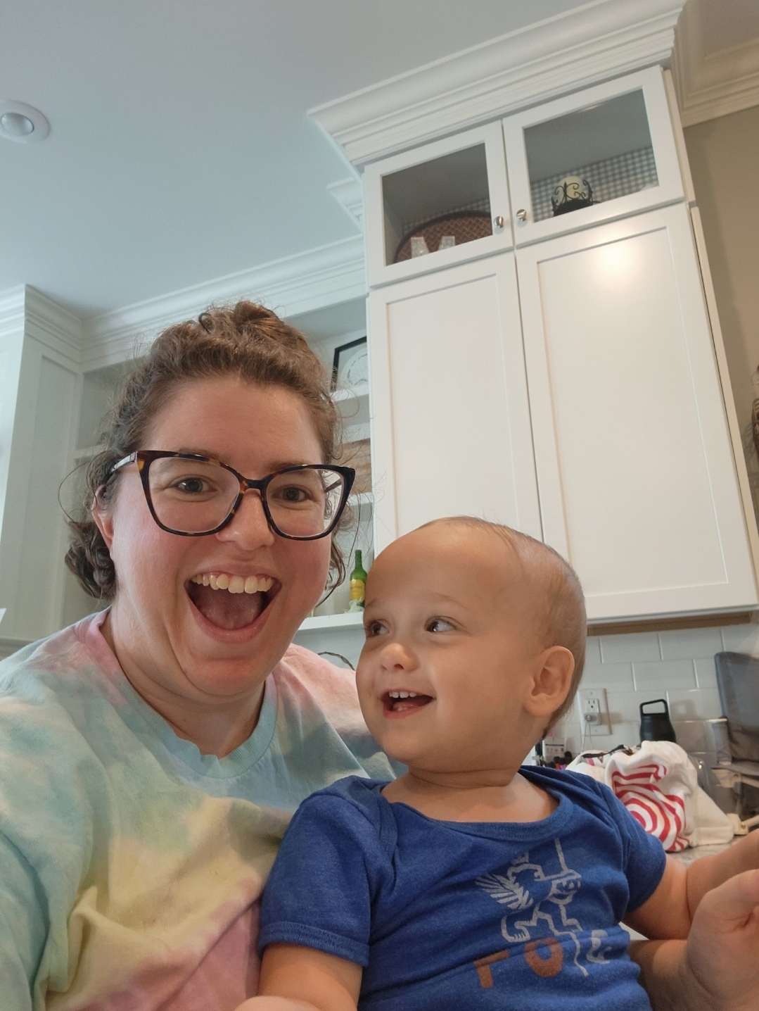 Smiling caregiver and infant