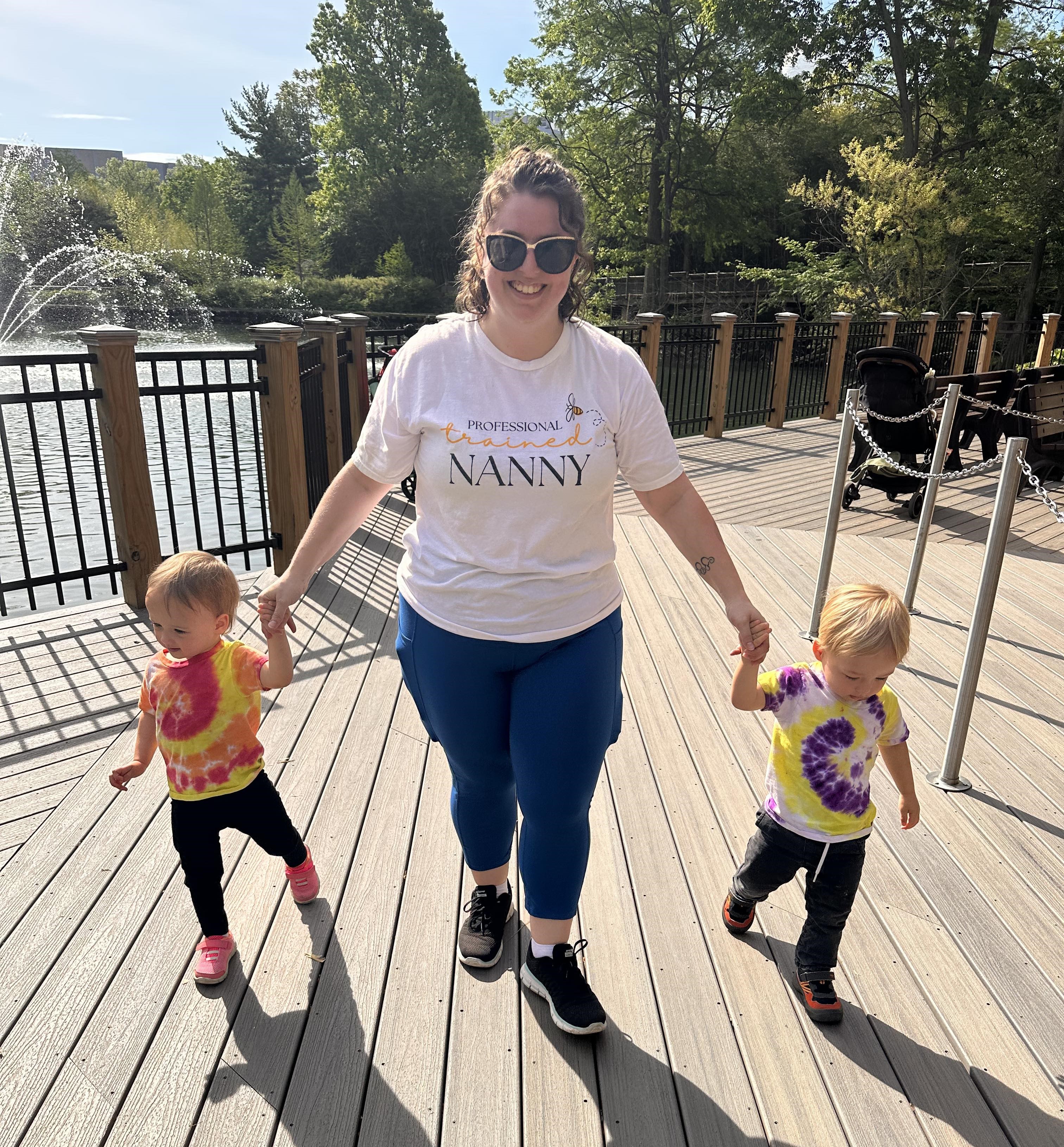 Caregiver walking with toddlers